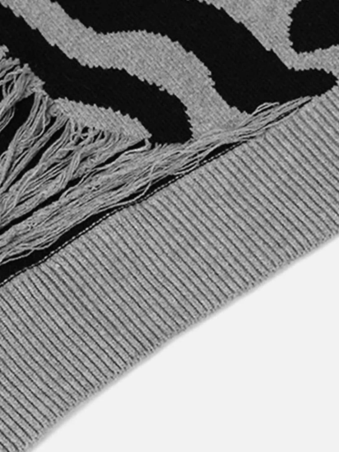 Texture and pattern showcased in the TALISHKO zebra-pattern sweater, highlighting unique details.