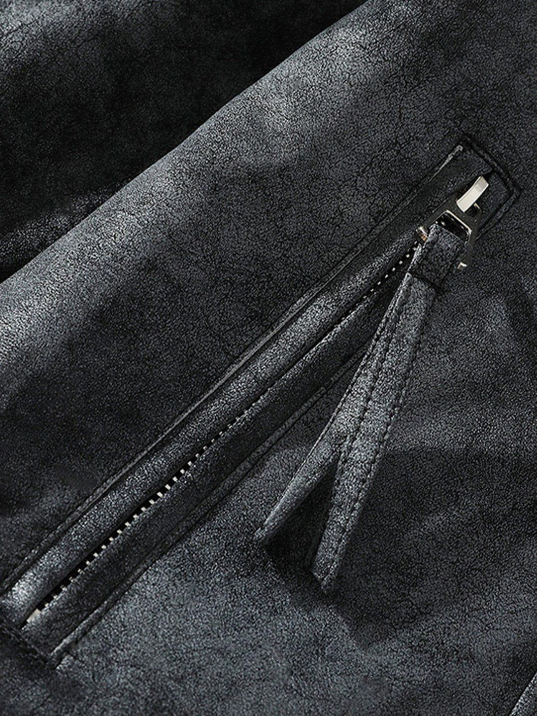 Detailed view of the TALISHKO faux leather jacket's zipper and texture, highlighting craftsmanship.