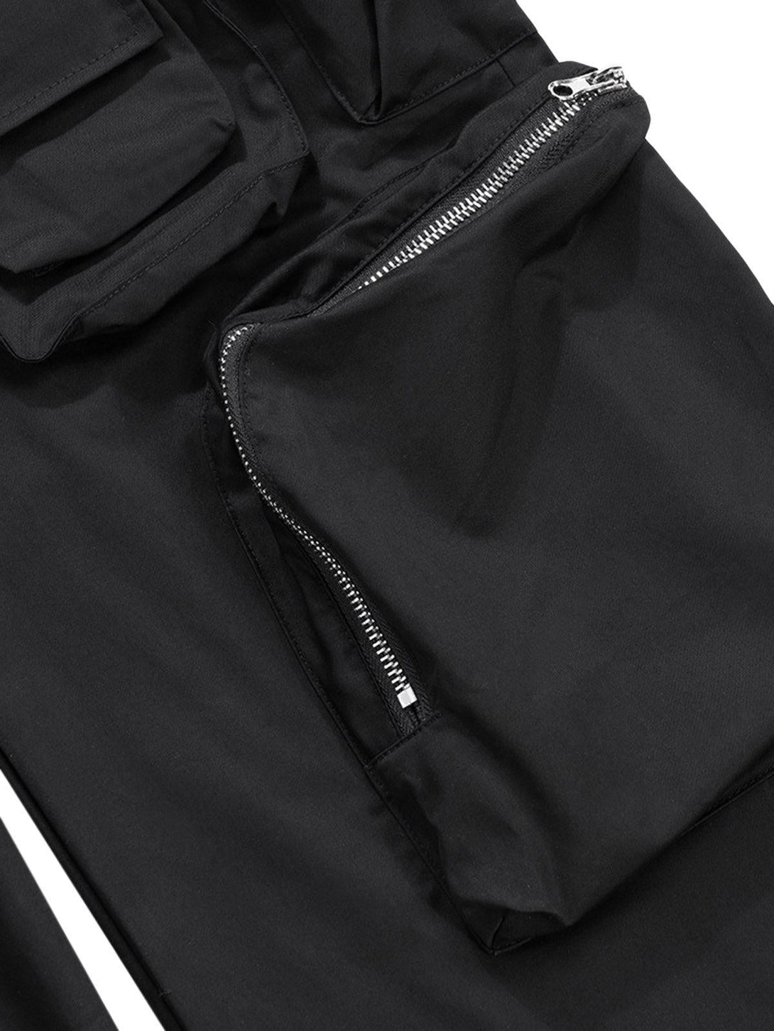 Detailed view of TALISHKO cargo pants showcasing functional multi-pocket design and sleek zippers.