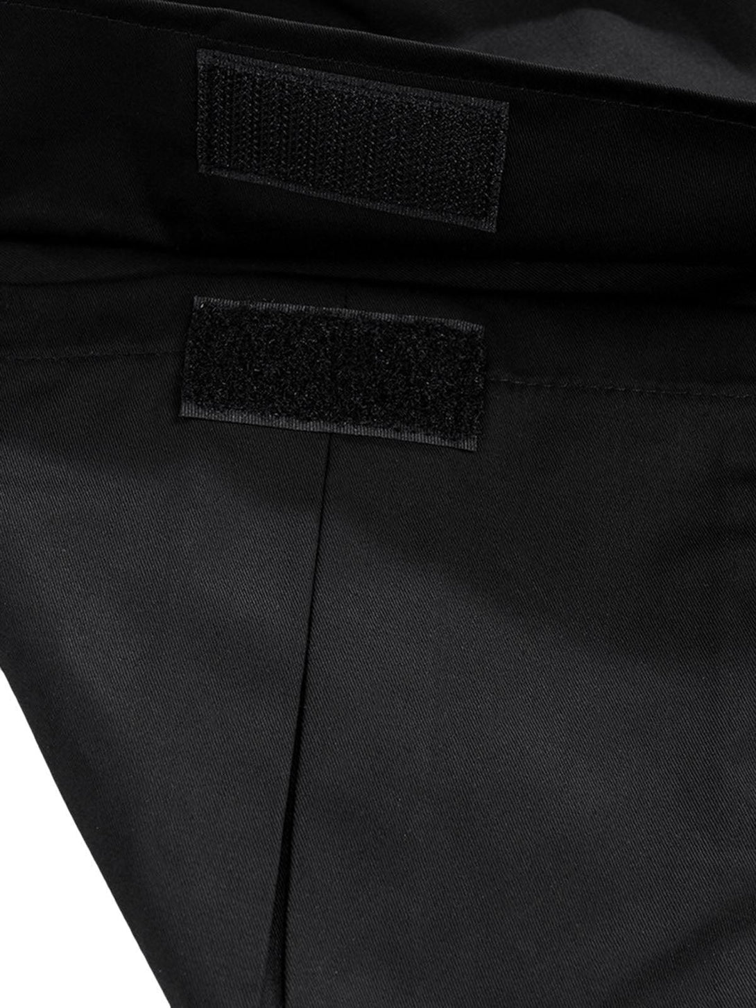Detailed fabric and Velcro closure on TALISHKO cargo pants, highlighting functionality.