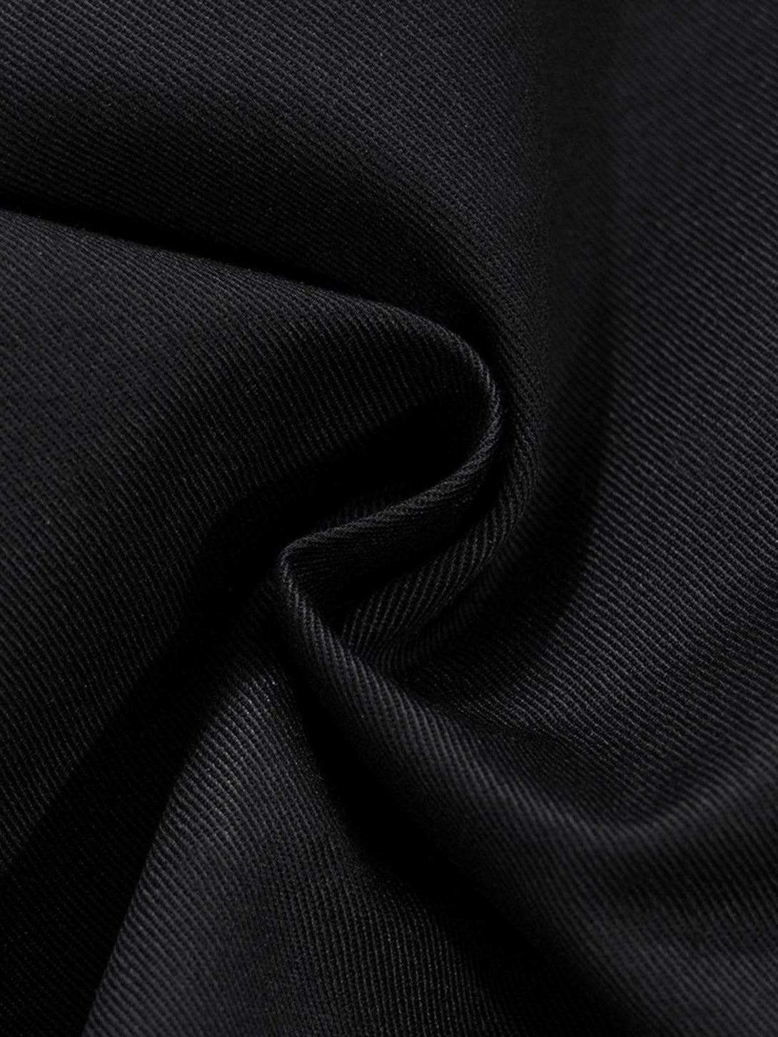 Zoomed-in texture of TALISHKO cargo pants fabric, highlighting durability and sleek design.