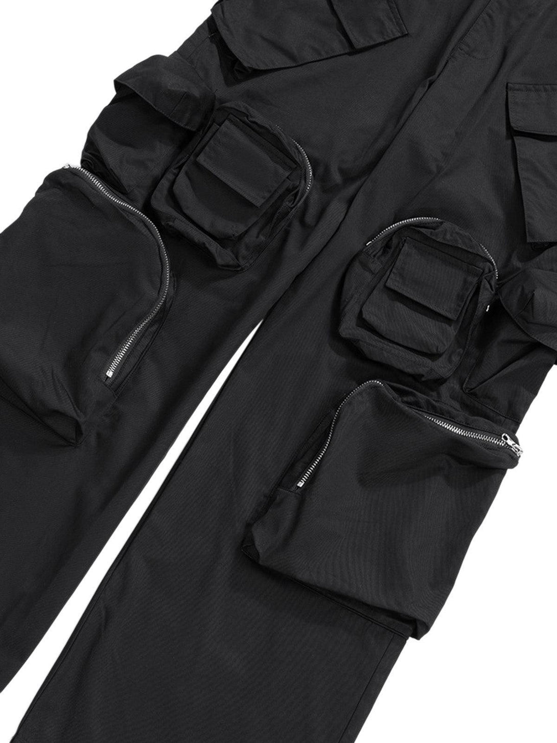 A close-up of TALISHKO cargo pants highlighting the functional multi-pocket design and zippers.