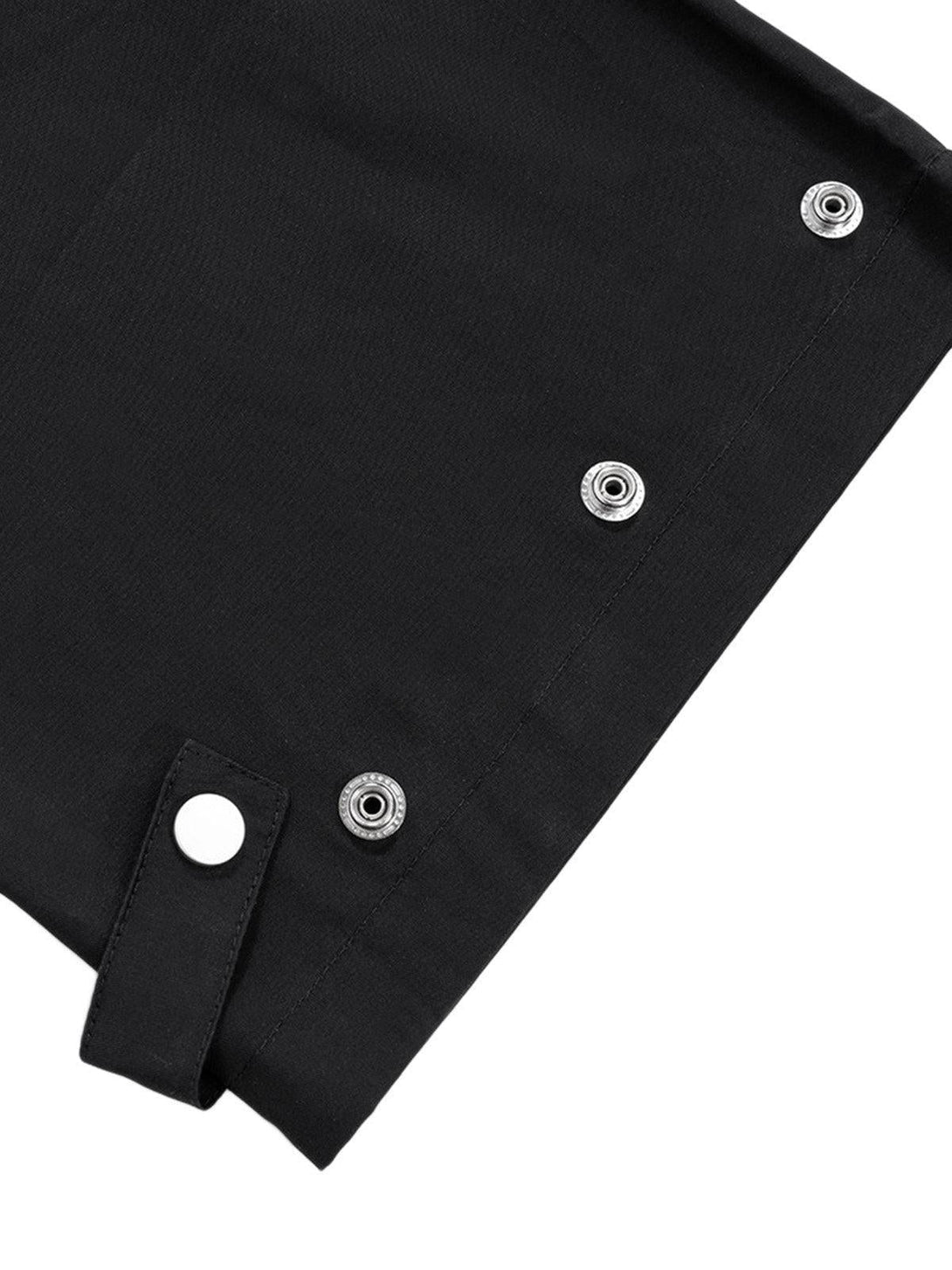 Close-up of TALISHKO cargo pants detailing snap closures and sturdy fabric.