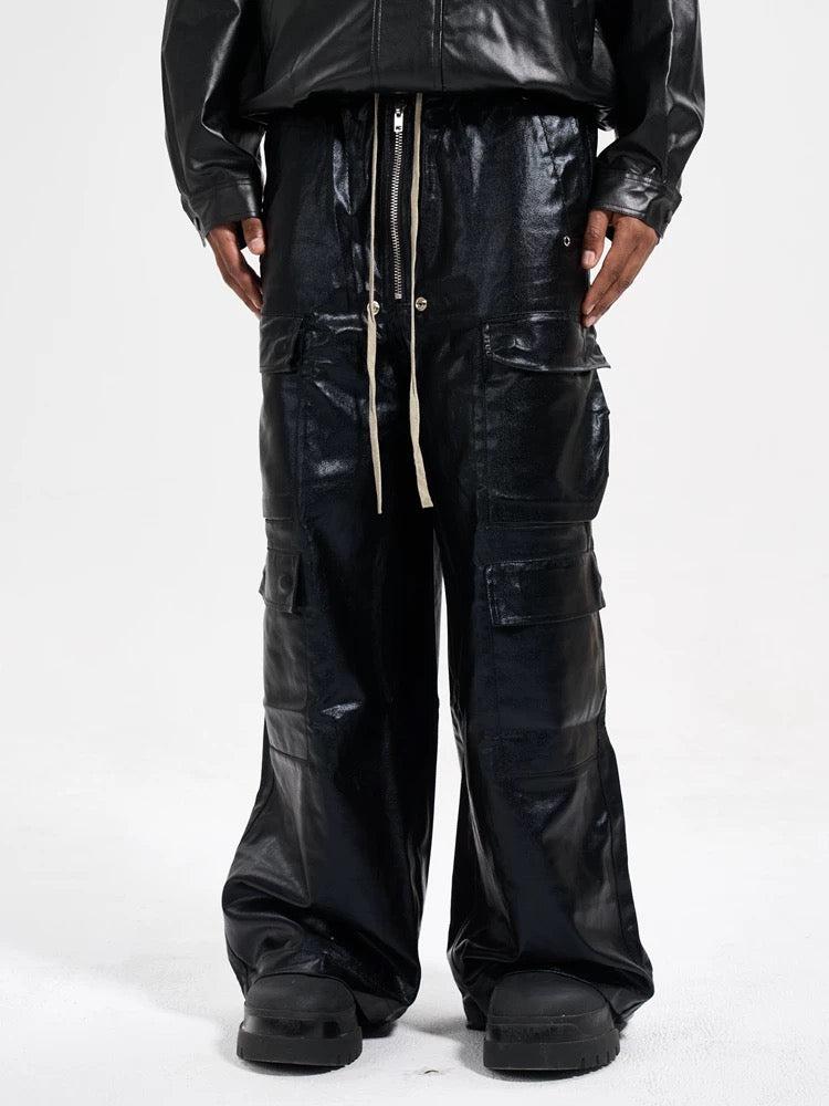 Model wearing TALISHKO matte coated overalls with multi-pocket design, highlighting urban fashion.
