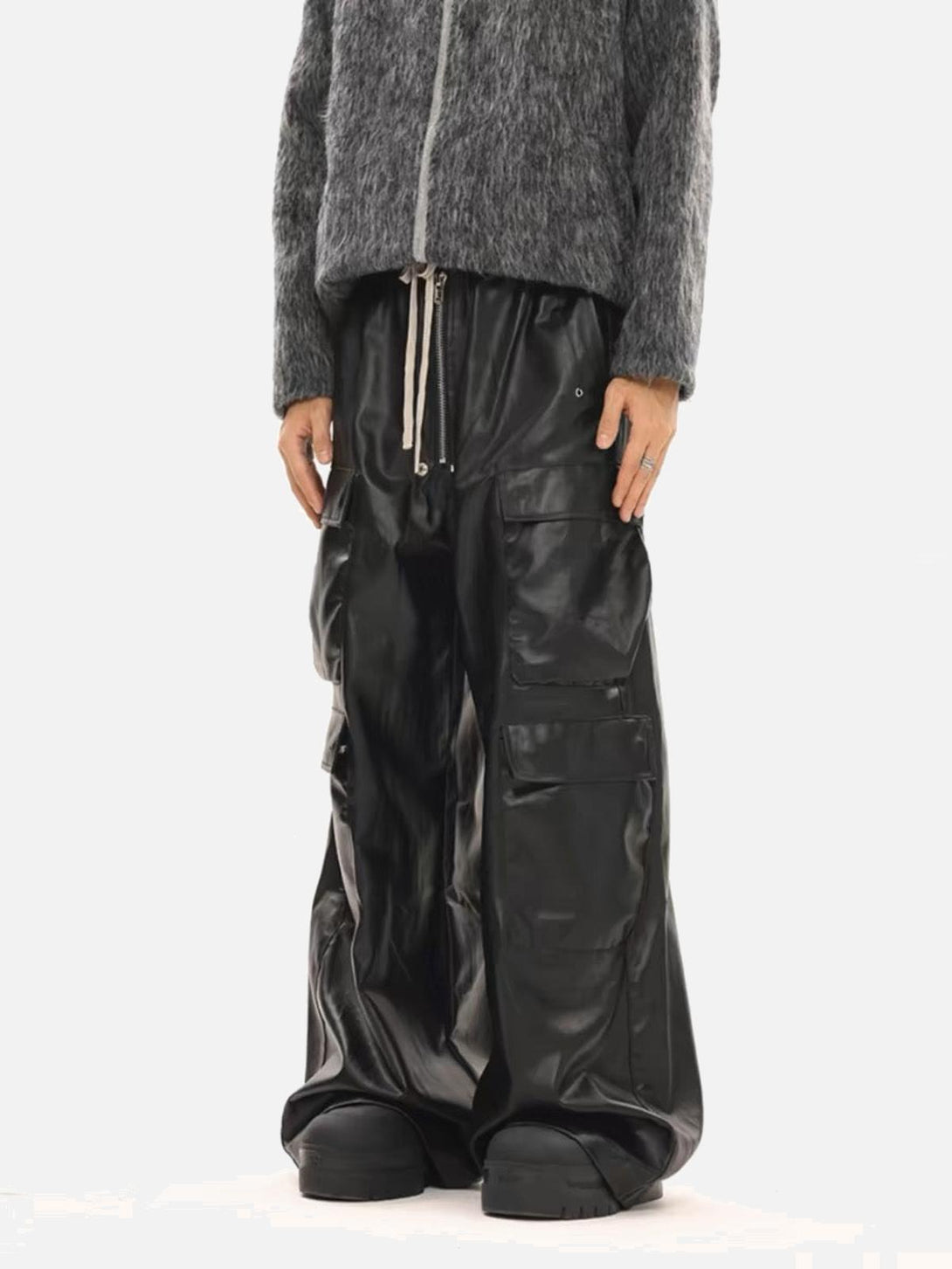 Model showcasing TALISHKO matte coated overalls with multi-pocket design, paired with gray top.