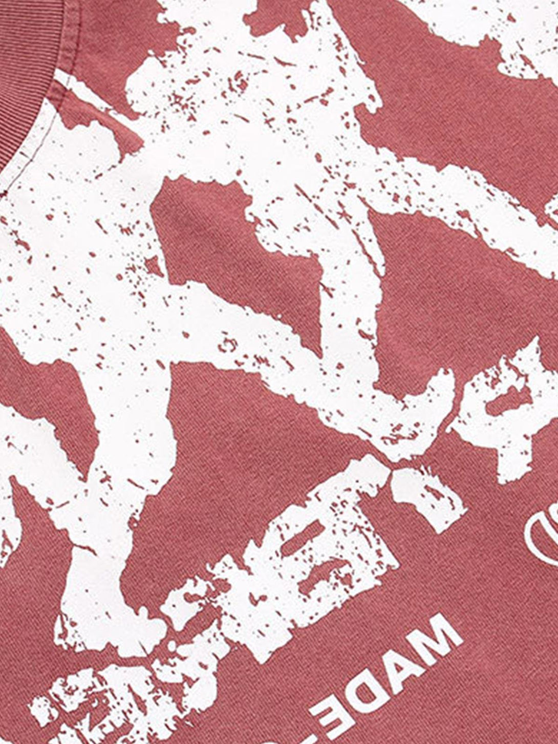 Zoomed-in texture of TALISHKO's retro letter print T-shirt, showcasing its rock-inspired design.