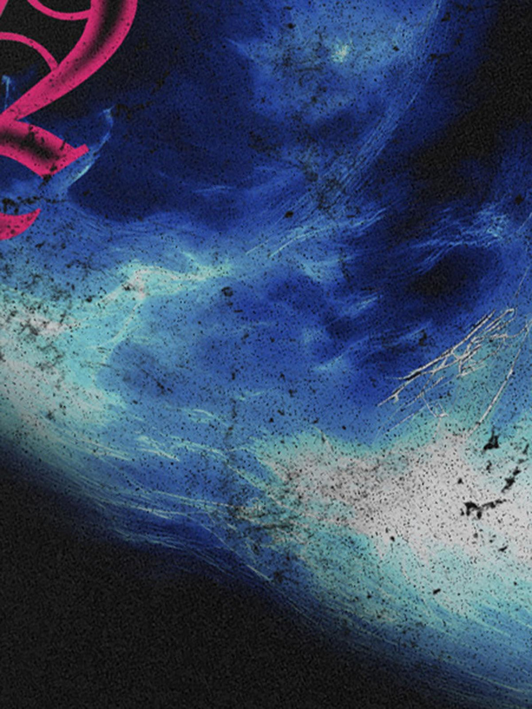 Intricate look at the vibrant blue and pink design on TALISHKO's "SAINT" graphic T-shirt.