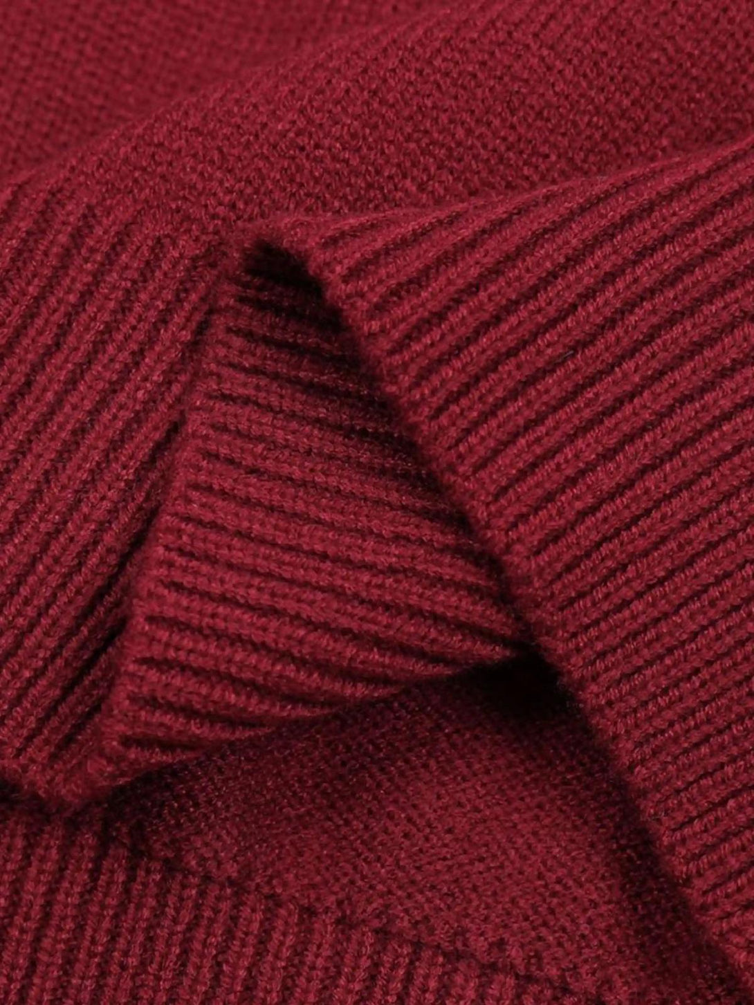 Texture and pattern showcased in the red Santa crewneck sweater by TALISHKO.