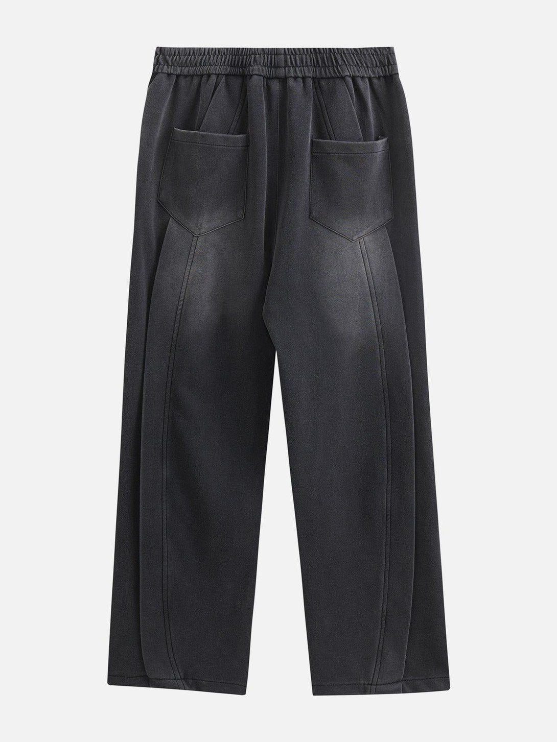 Back view of TALISHKO patchwork sweatpants, highlighting deep pockets and relaxed fit.