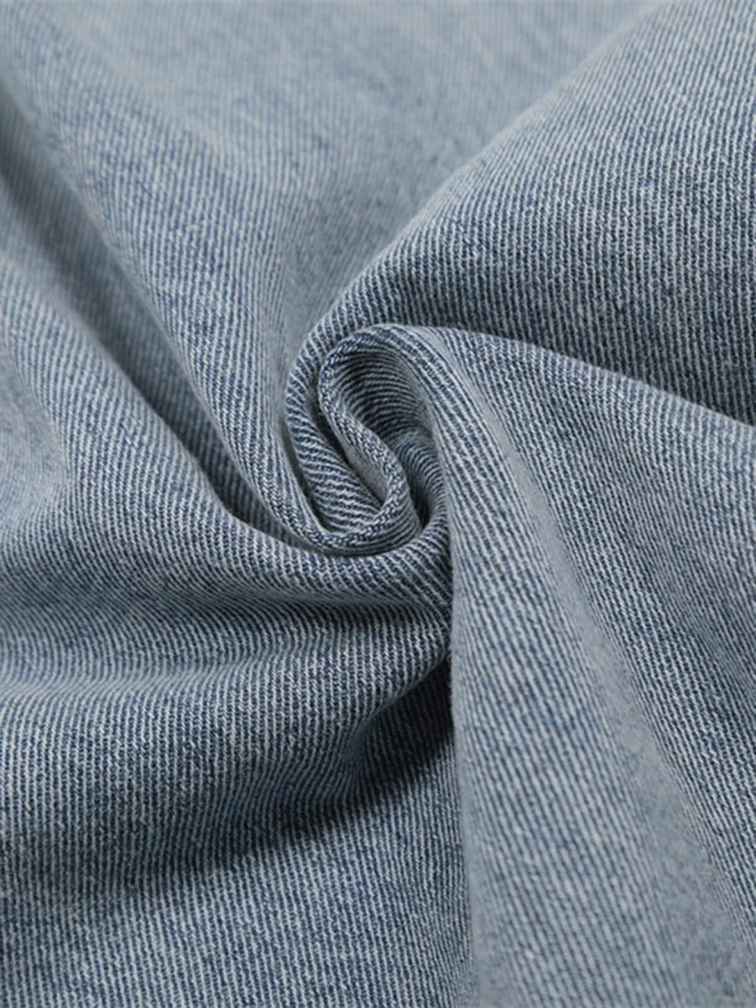 Texture and pattern showcased in TALISHKO pleated baggy jeans fabric for a unique style.