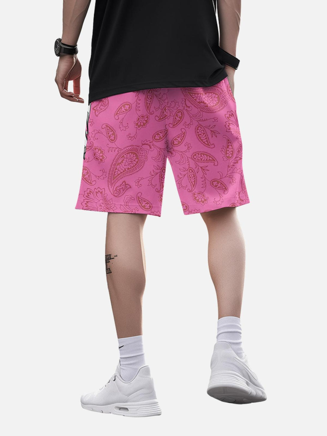 Back view of pink paisley hip-hop shorts by TALISHKO, styled for casual summer outings.
