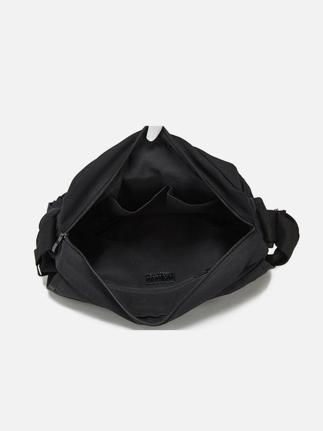 Open view of TALISHKO crossbody bag interior, showcasing spacious compartments and sleek design.