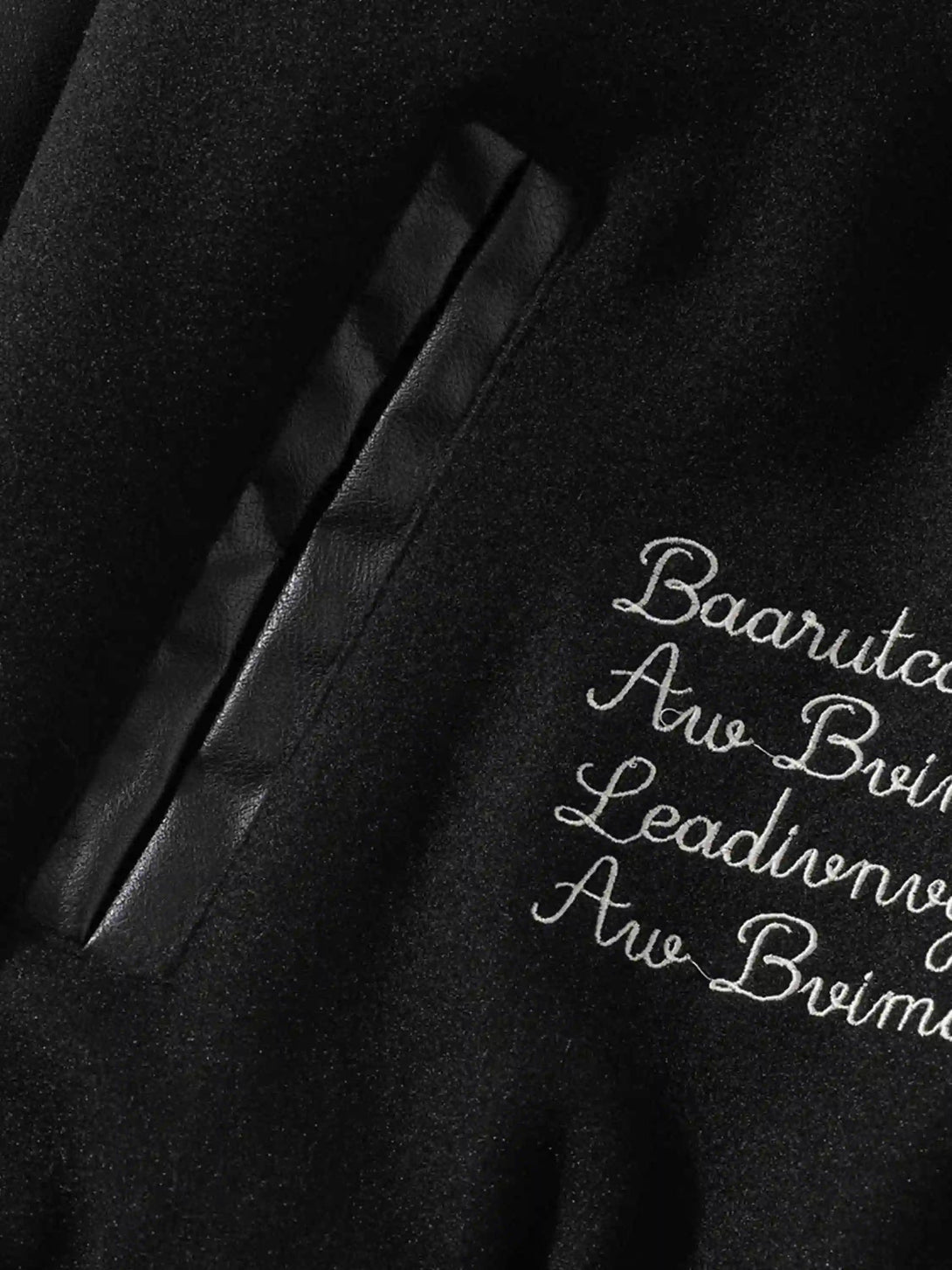 Detailed view of TALISHKO jacket embroidery and pocket design, highlighting unique craftsmanship.
