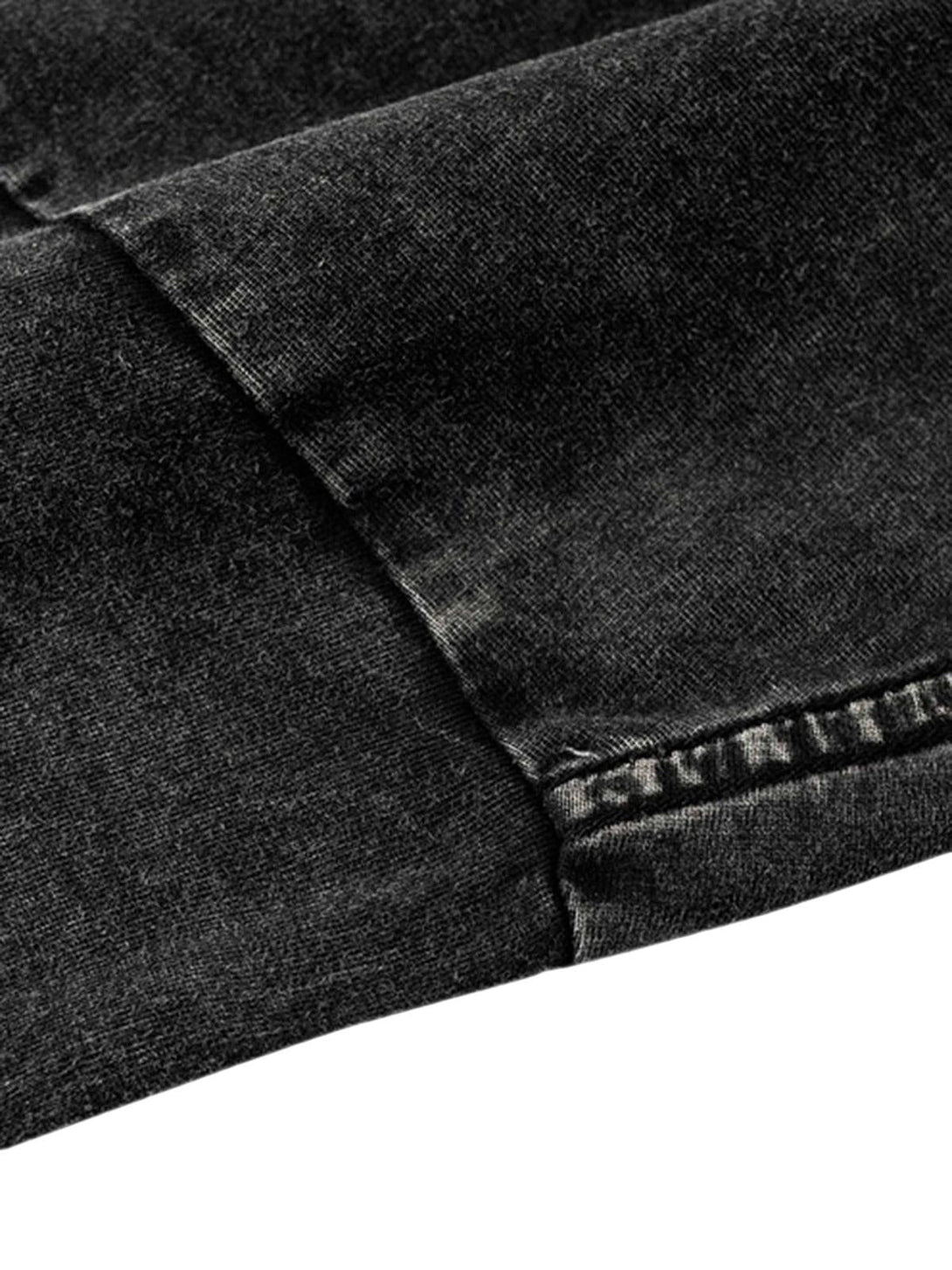 Intricate look at TALISHKO's washed black fabric, showcasing the texture of this casual T-shirt.