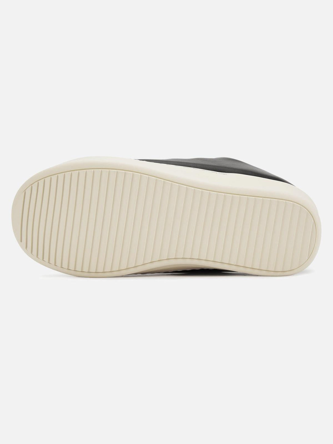 Cream sole detail of TALISHKO slip-on sneakers, highlighting the sleek streetwear design.