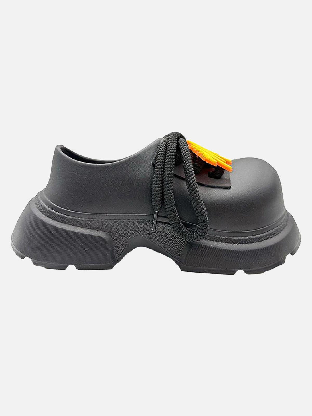 Side view of TALISHKO slip-on derby platform shoes with unique black laces and orange detail.