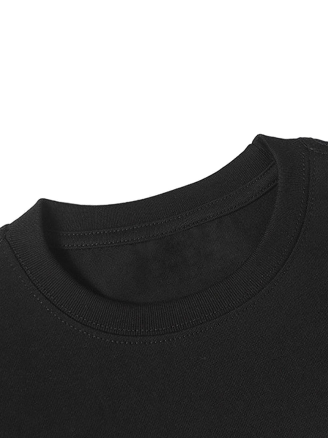 A detailed look at the neckline of a black TALISHKO slogan graphic T-shirt, showcasing craftsmanship.