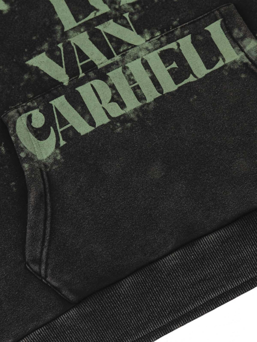 A detailed look at the smudge-dyed letter print on a TALISHKO hoodie, highlighting its texture.