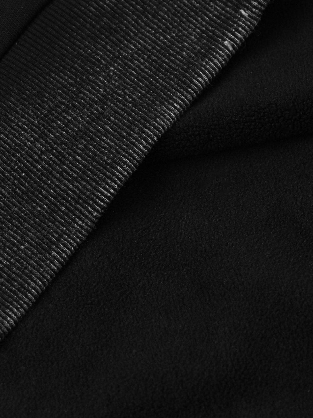 Ribbed texture and soft fabric detail of TALISHKO hoodie, highlighting cozy craftsmanship.