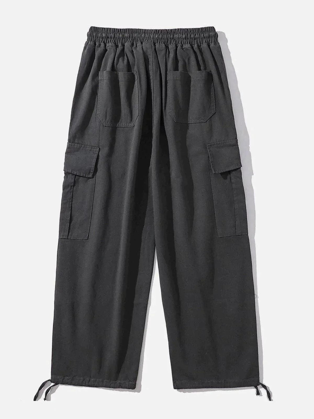 Back view of dark gray cargo pants with large pockets and drawstring cuffs by TALISHKO.