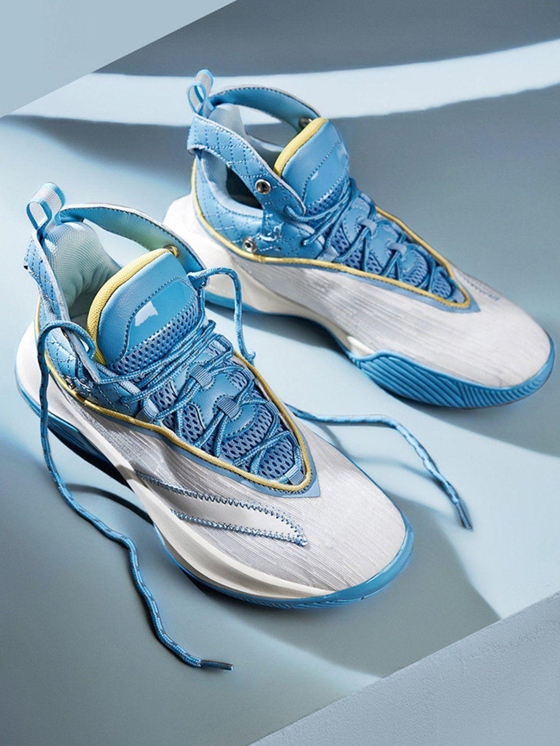 TALISHKO sneakers in blue and white, featuring breathable material and unique design elements.