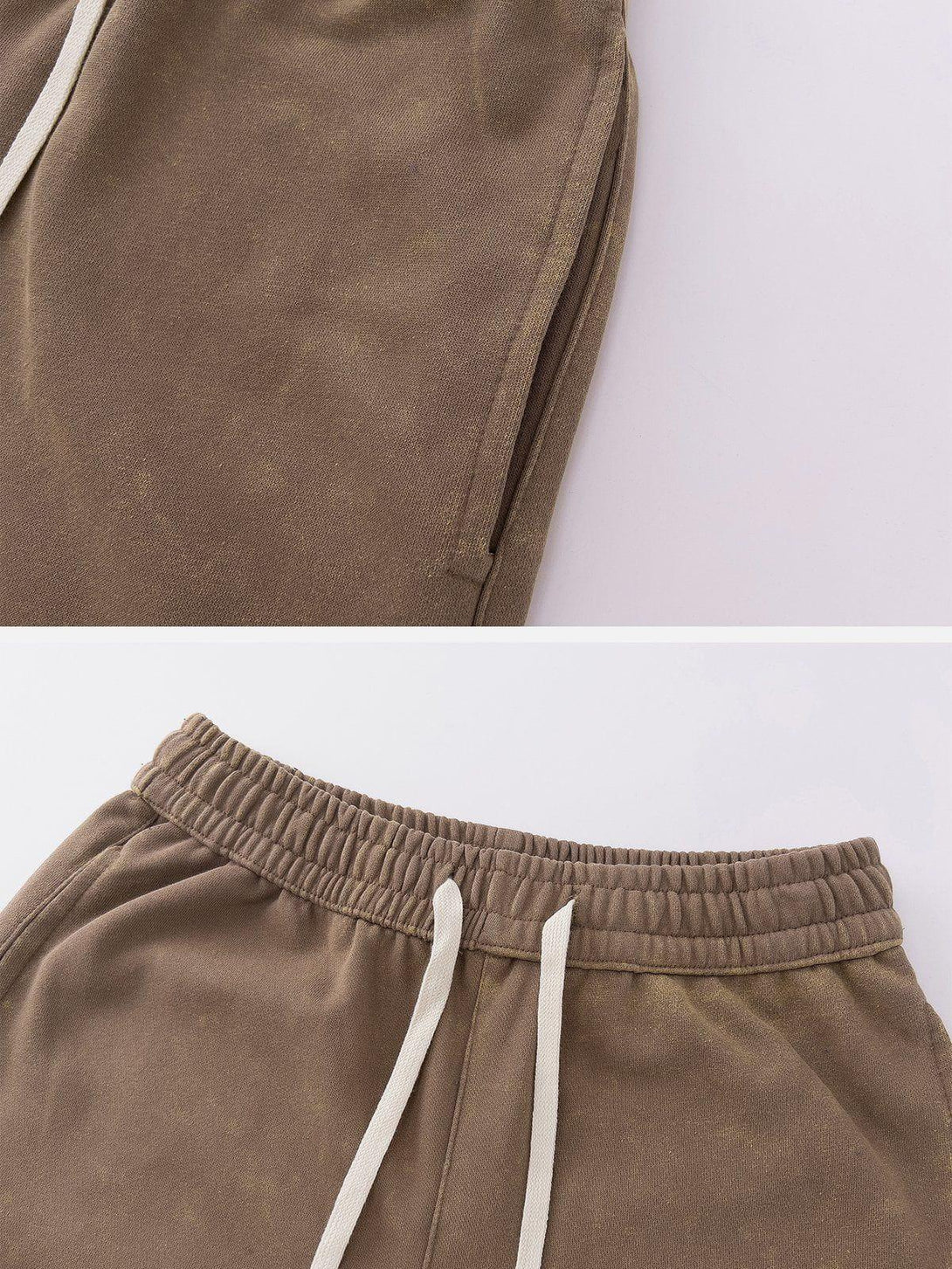 Detailed view of TALISHKO's brown drawstring pants, showcasing elastic waistband and texture.