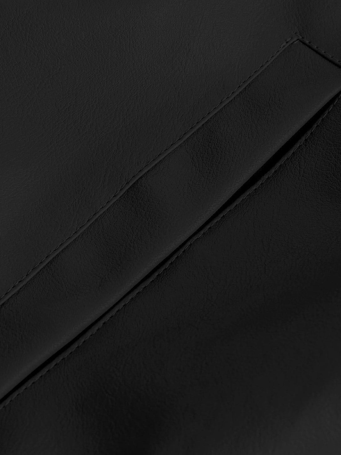 Detailed view of the TALISHKO faux leather jacket, highlighting its smooth texture and craftsmanship.