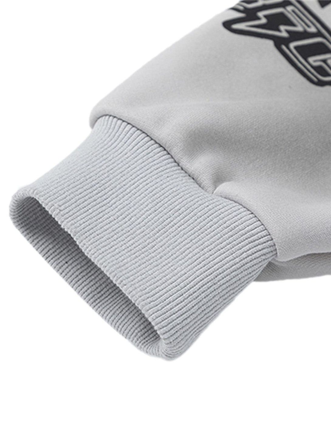Ribbed cuff detail on TALISHKO gray racing hoodie, highlighting its textured finish.