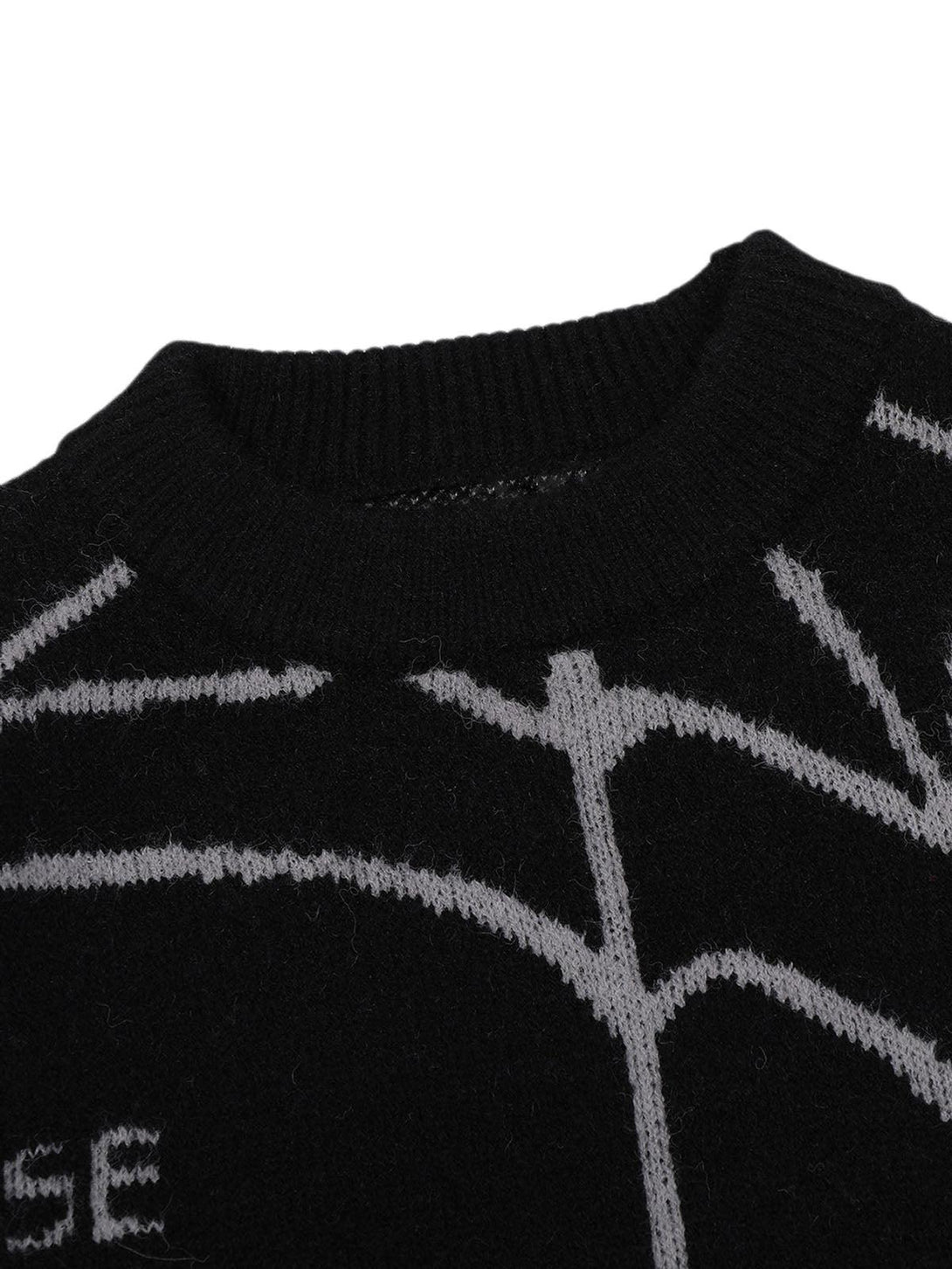 Detailed view of TALISHKO's knit sweater, highlighting the black and gray spider pattern.