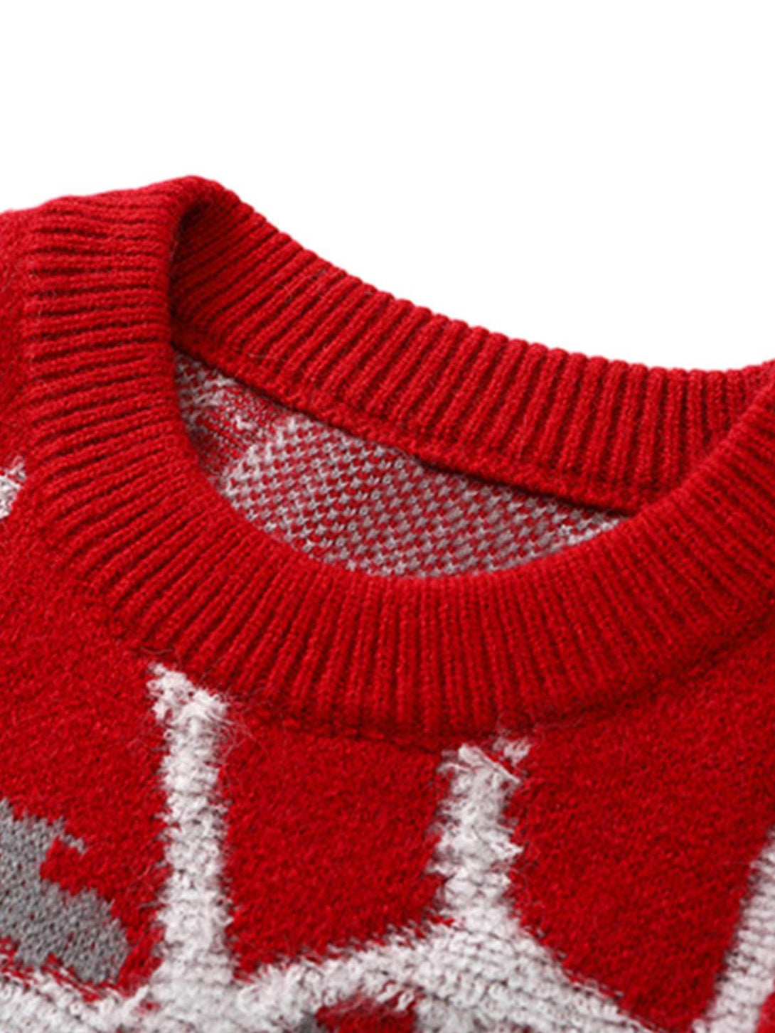 Close-up of TALISHKO's red knit sweater collar, highlighting the intricate spider web pattern.