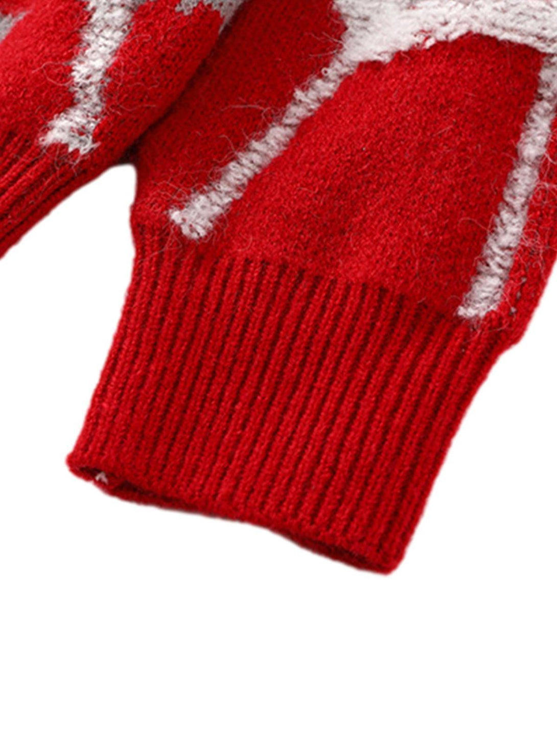 Ribbed cuff detail on TALISHKO's red knit sweater, highlighting the cozy texture and style.