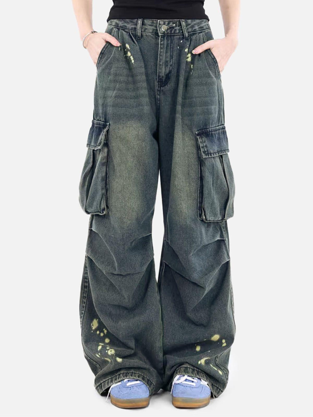 TALISHKO baggy jeans with splash-ink wash, worn by model, featuring large side pockets.