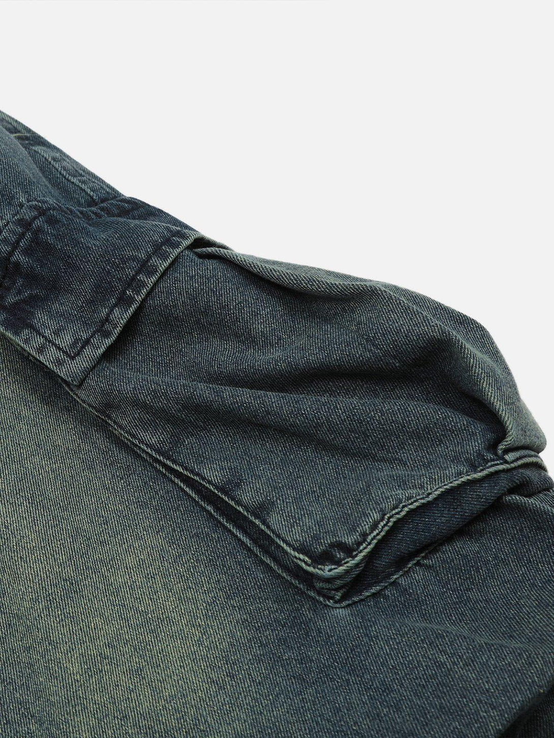 A detailed view of the splash-ink wash on TALISHKO baggy jeans, highlighting the unique texture.