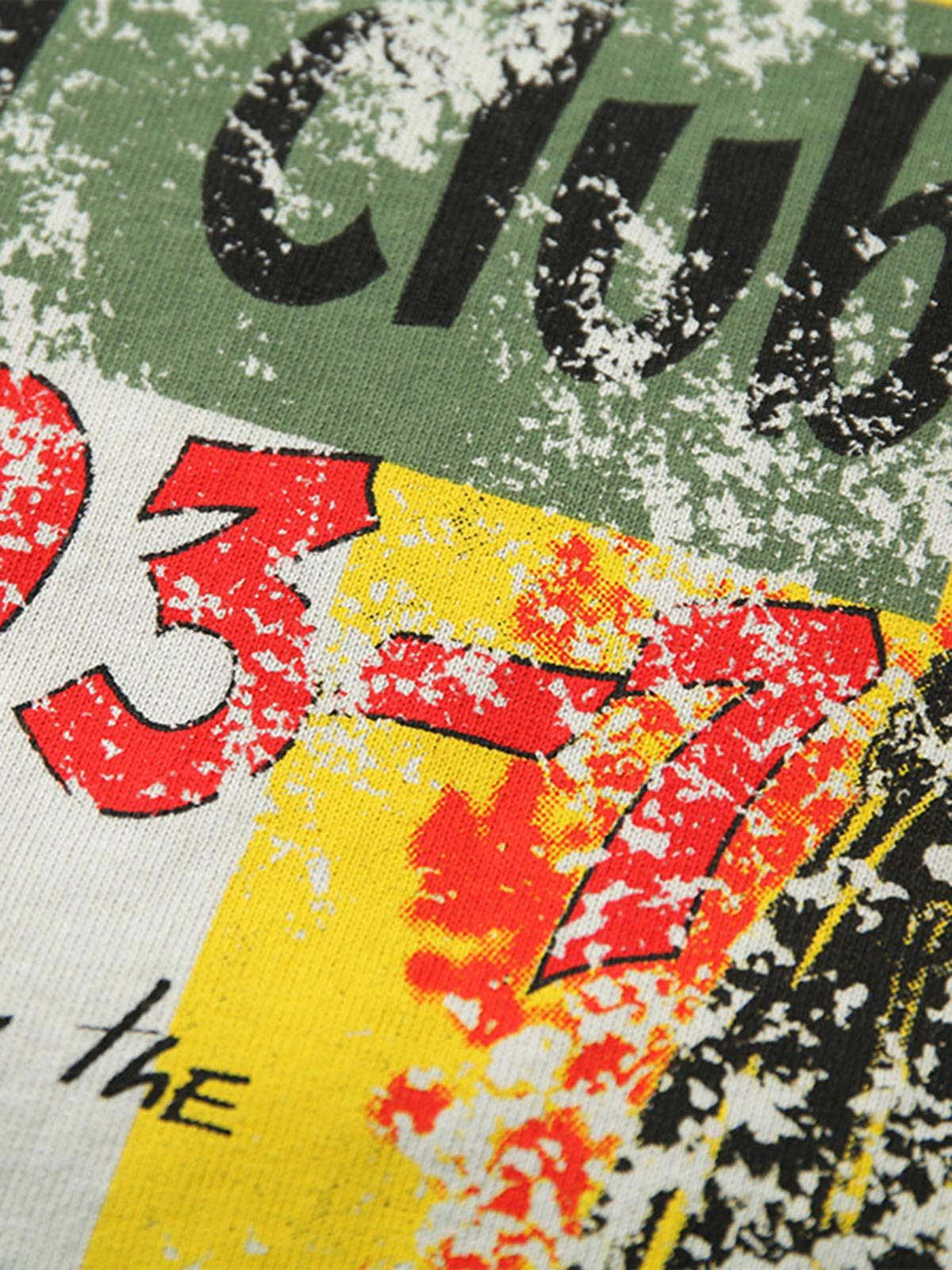 Intricate look at the spliced deconstruction print on TALISHKO's T-shirt, featuring bold colors.