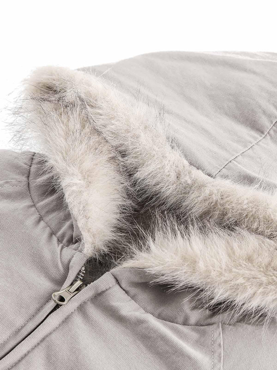 Detailed view of TALISHKO's quilted jacket fur-lined hood, showcasing luxurious texture.