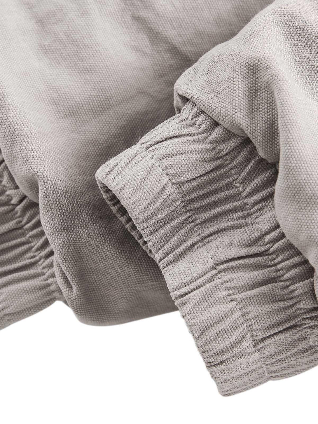 Intricate look at the ribbed cuffs of TALISHKO's spliced quilted jacket, highlighting texture.