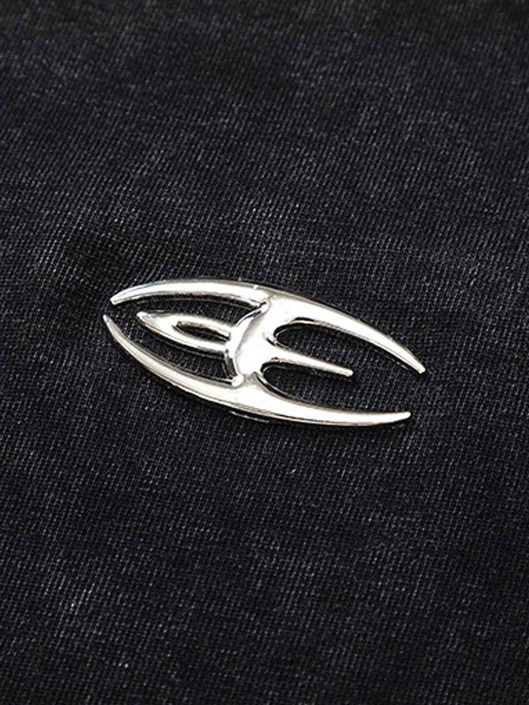 Intricate design detail on a TALISHKO split raw edge short sleeve T-shirt, adding unique flair.