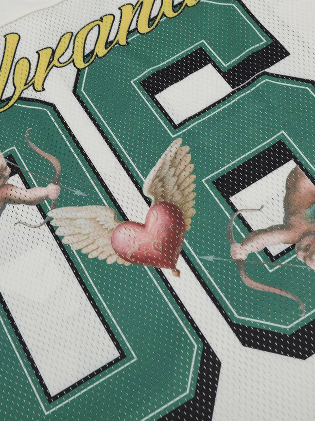 A detailed view of cherub and heart graphics on a TALISHKO sports jersey V-neck T-shirt.