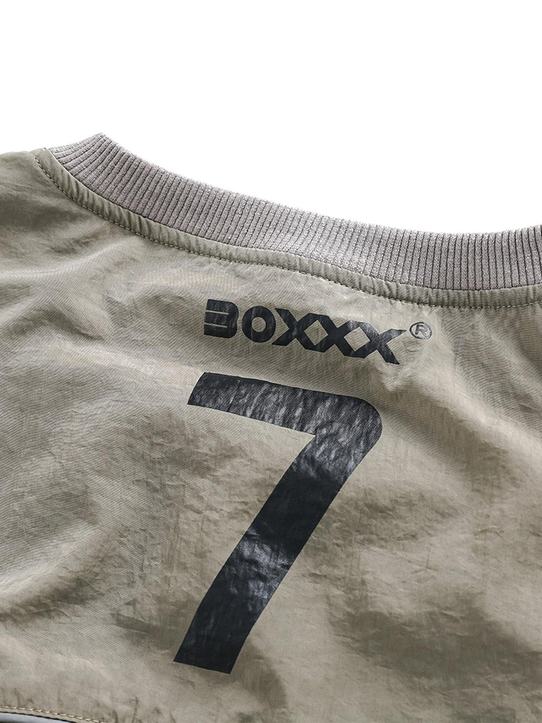 Back detail of TALISHKO sporty long-sleeve T-shirt showcasing number 7 and brand logo.