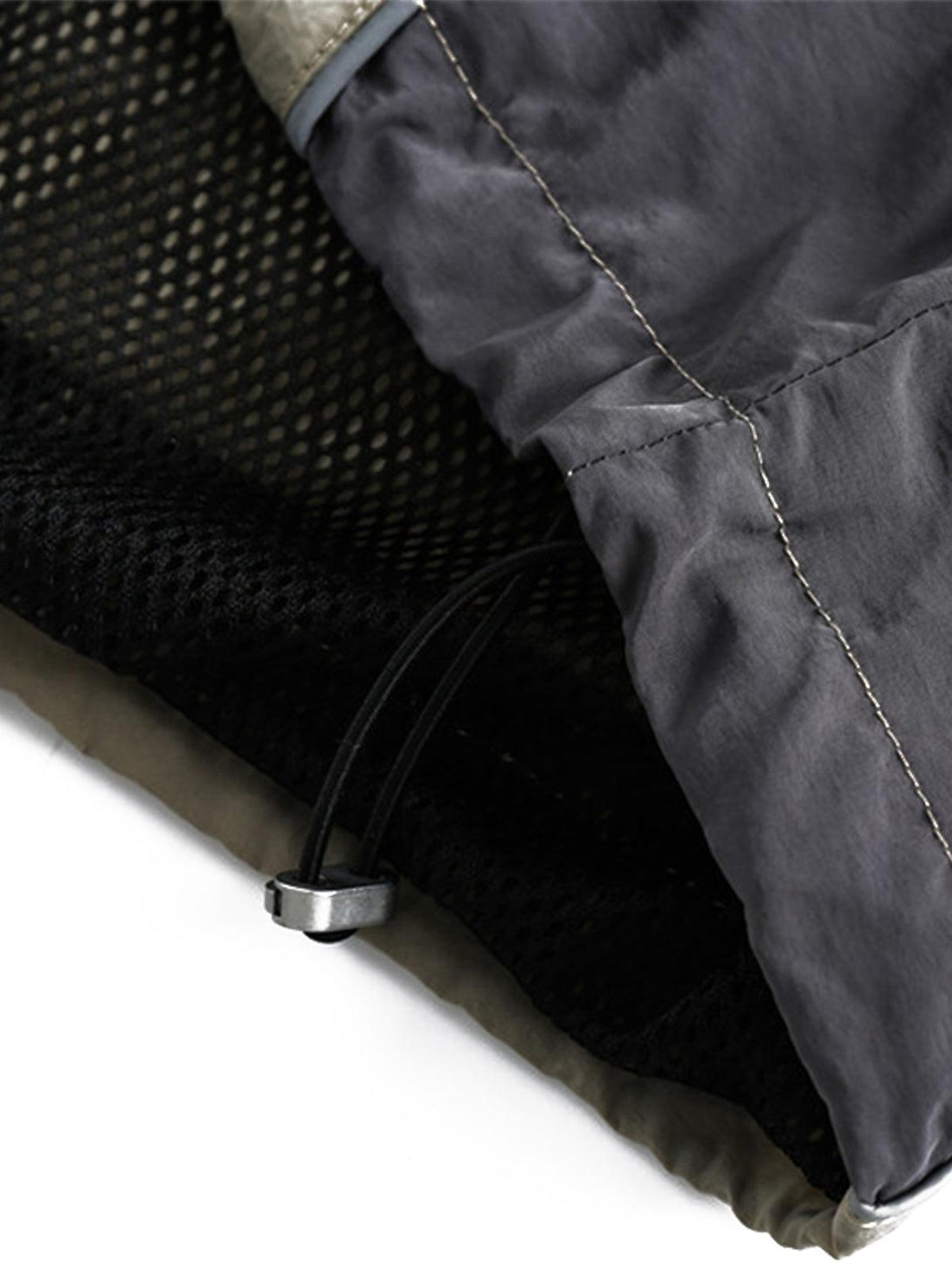 Intricate look at TALISHKO sporty T-shirt's drawstring detail and mesh lining.