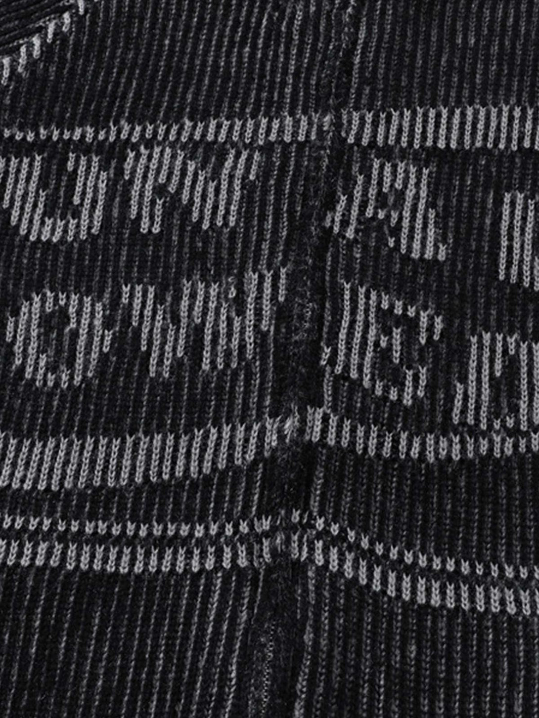 Intricate look at TALISHKO's sweater texture and pattern, highlighting the bold knit design.