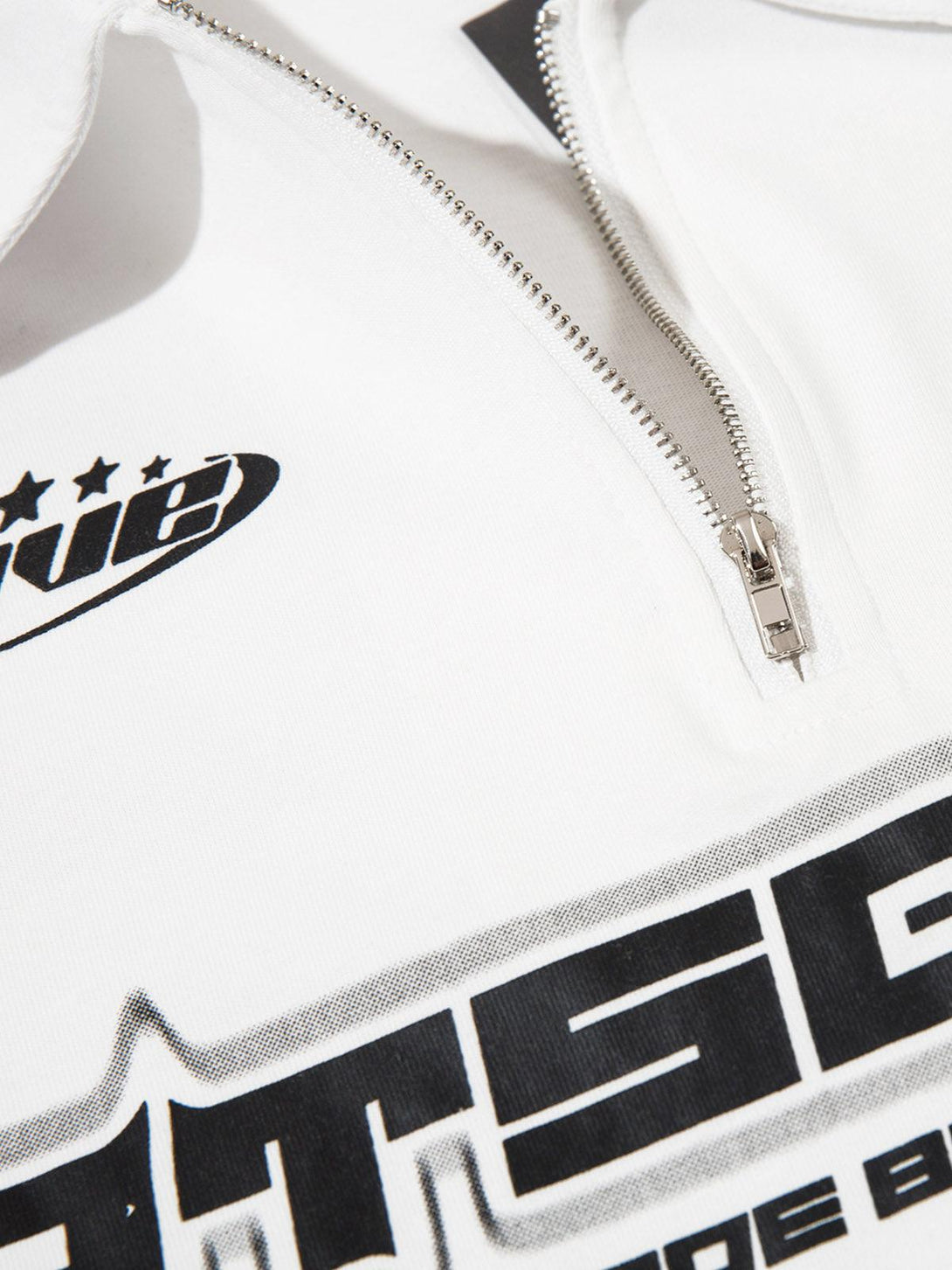 Focusing on the quarter zipper detail and bold graphics of TALISHKO's star-themed long sleeve shirt.