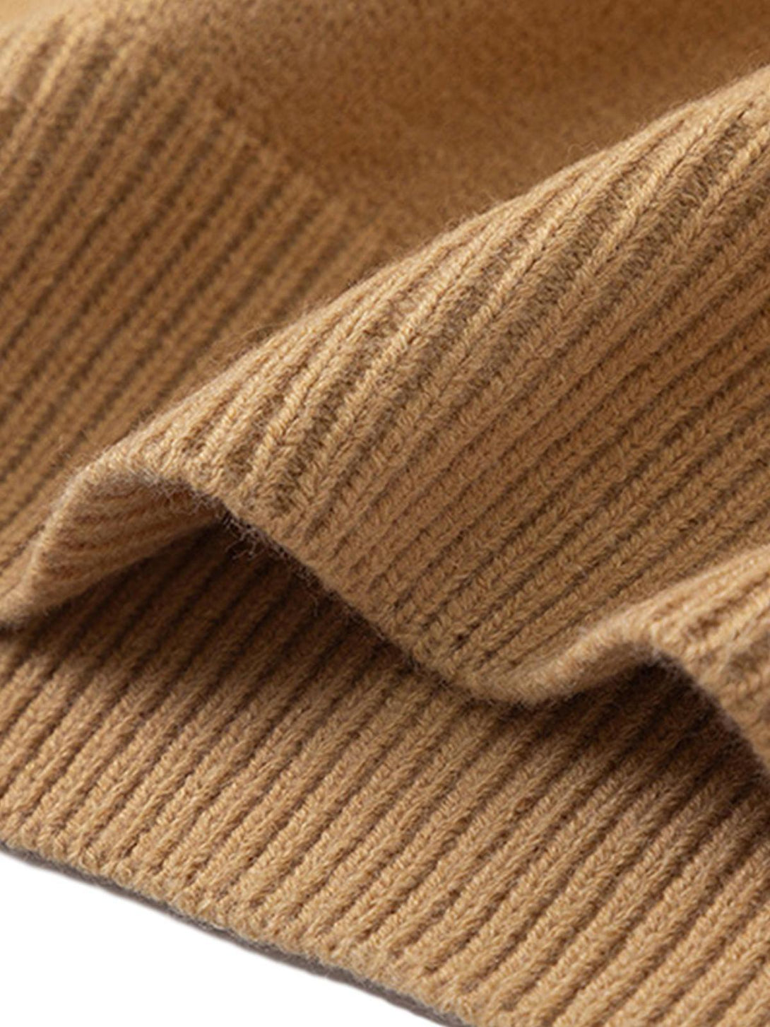Ribbed texture detail of a camel knit sweater, showcasing quality fabric by TALISHKO.