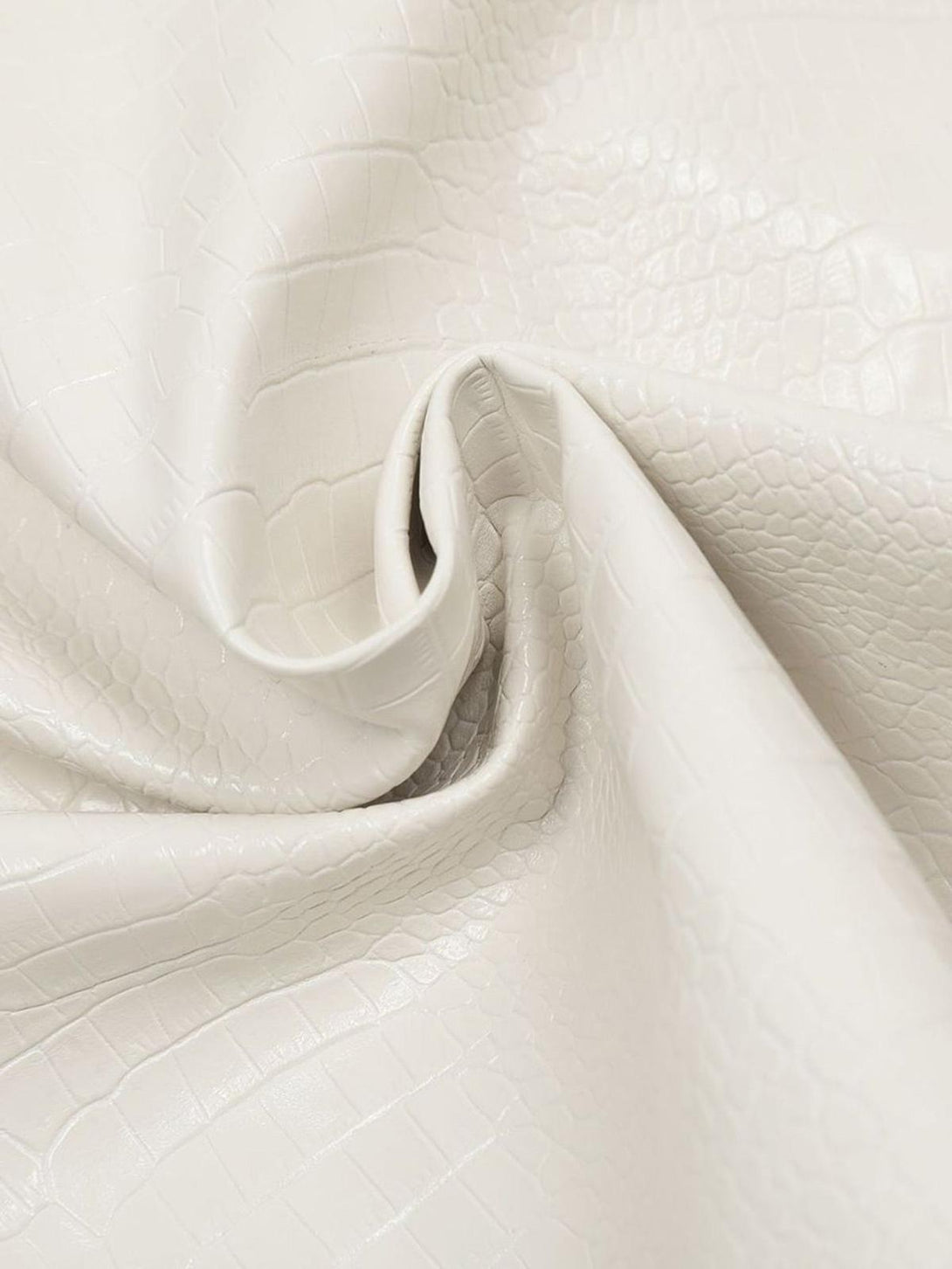 Texture and pattern showcased in the TALISHKO PU leather jacket, highlighting luxurious details.
