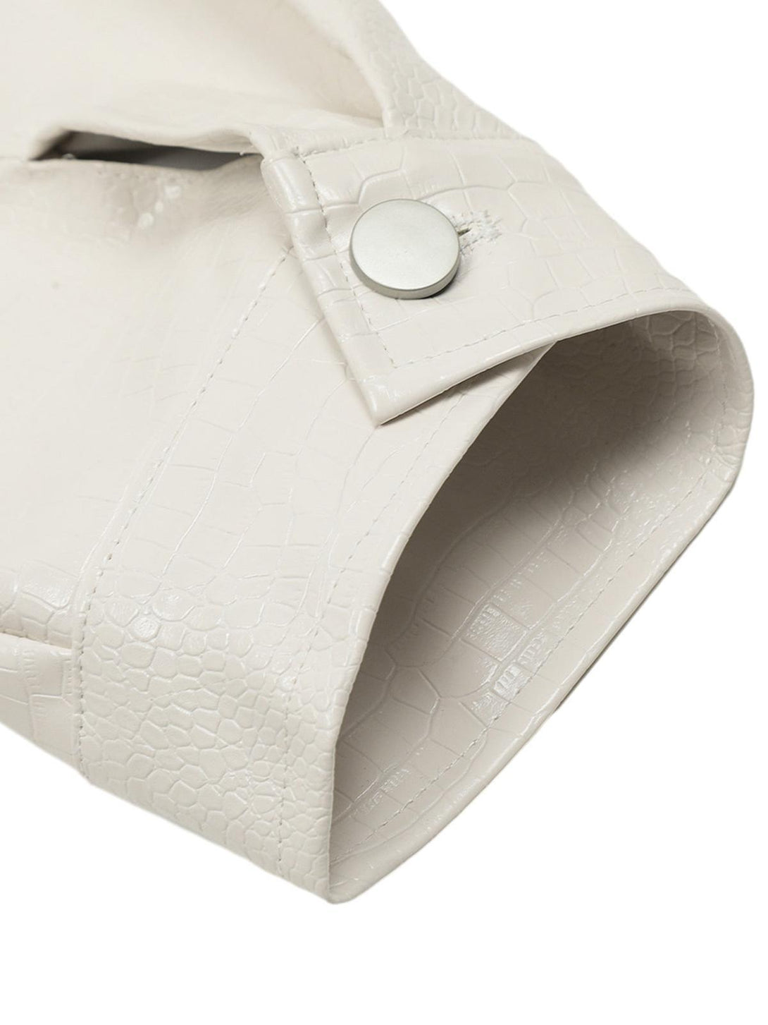 A detailed look at the TALISHKO white PU leather jacket sleeve, highlighting the textured pattern.