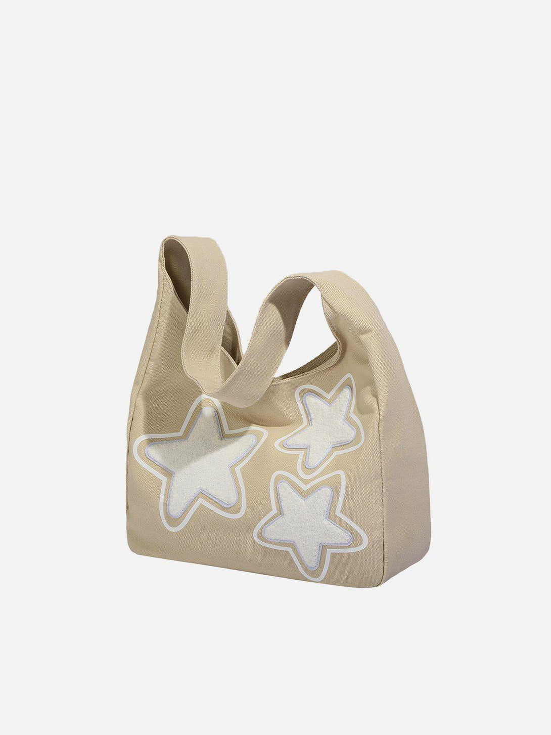 Side view of beige star graphic tote bag by TALISHKO, featuring playful star patterns.