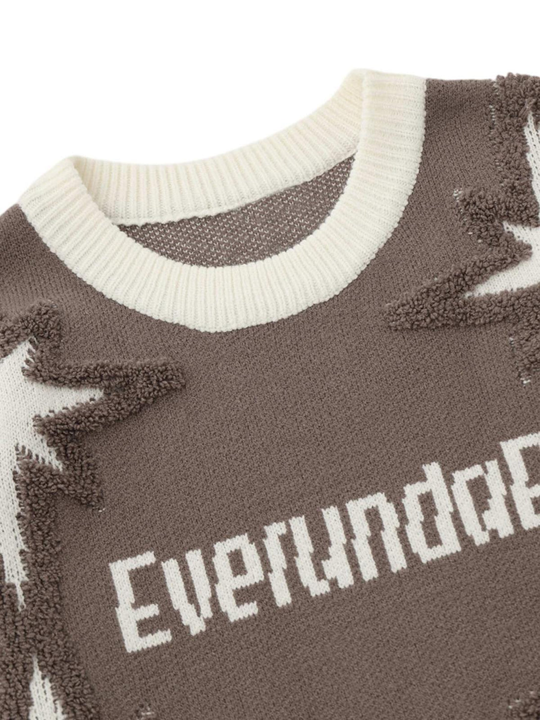 Intricate look at TALISHKO's star jacquard crew neck sweater, showcasing texture and design.