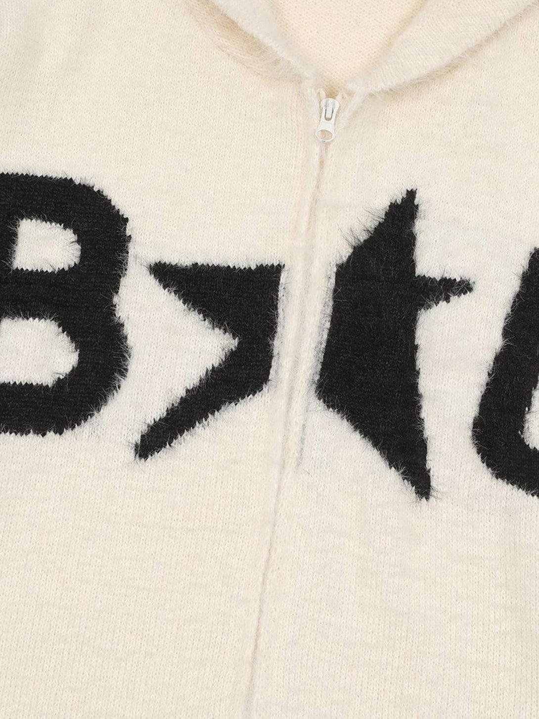 Intricate look at TALISHKO's white hooded cardigan, featuring bold black lettering detail.