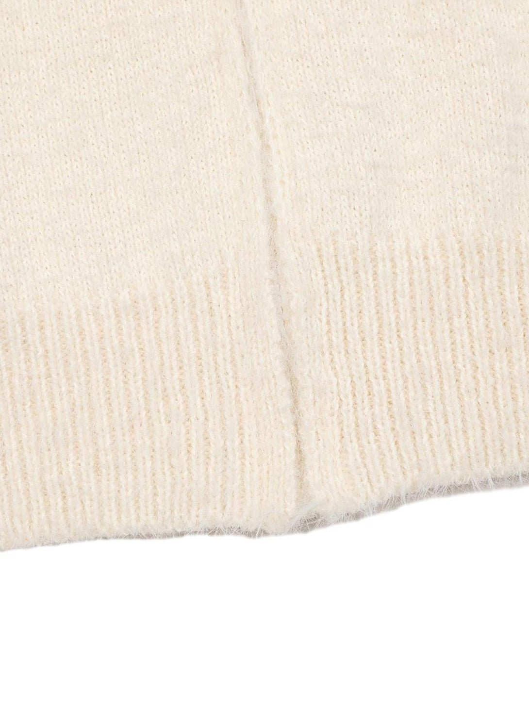 A close-up of TALISHKO's white cardigan sweater, highlighting its soft knit texture.
