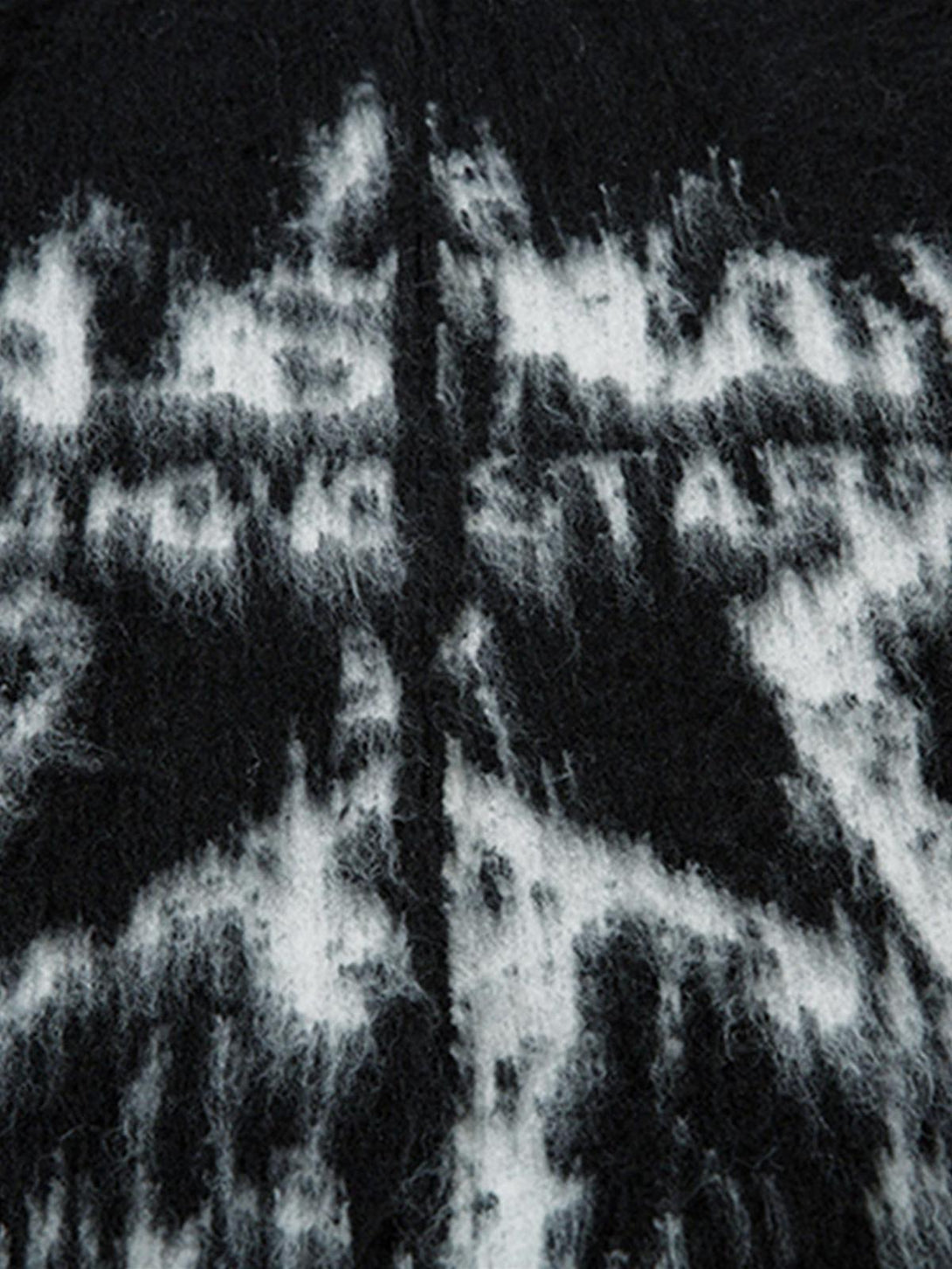 Zoomed-in texture of a mohair fuzzy sweater by TALISHKO, highlighting the bold star pattern.